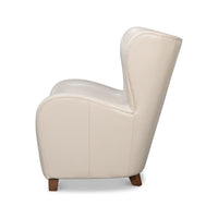White leather wing chair side profile.