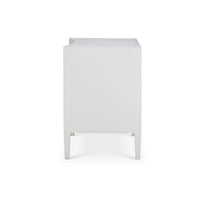 Side view of white modern nightstand, simple design.