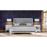 Nightstand beside bed in stylish bedroom decor.
