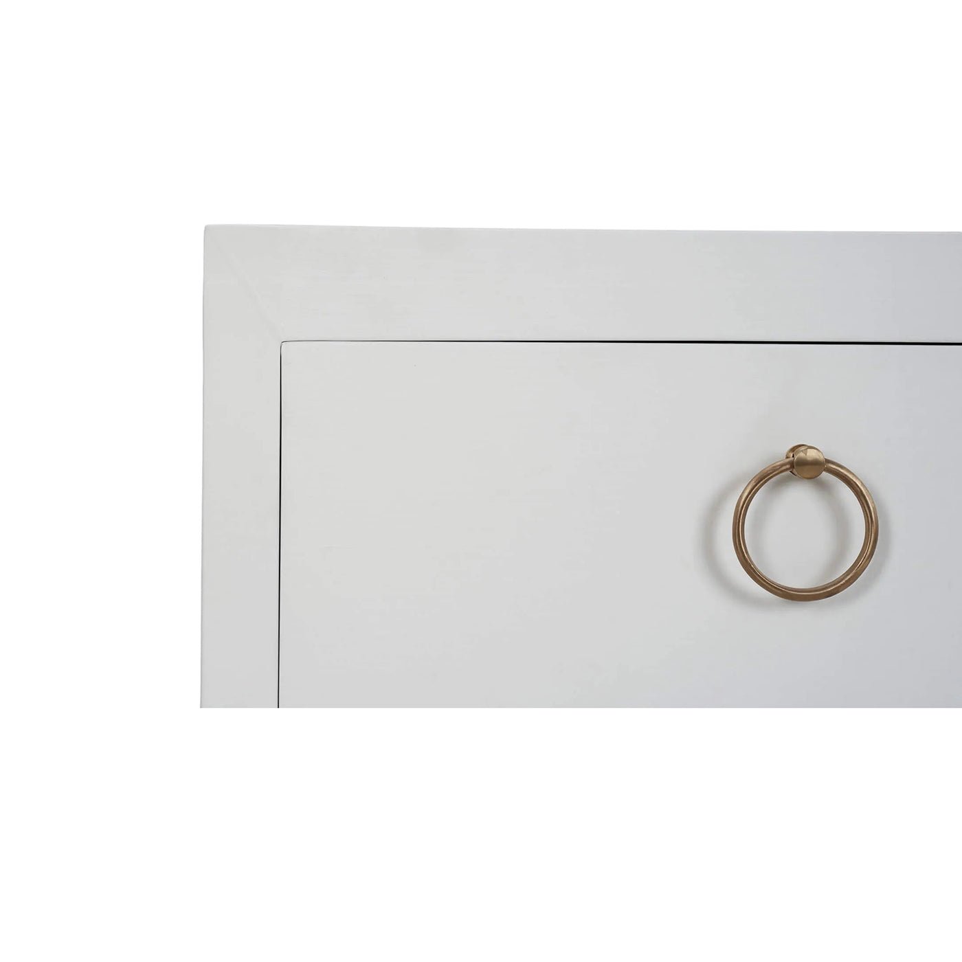 Corner view of nightstand drawer and handle detail.