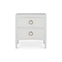Front view of modern nightstand with gold handles.