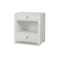 Angled view of white linen nightstand with gold handles.