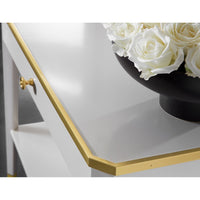 Close-up of White Mid Century table with gold trim.