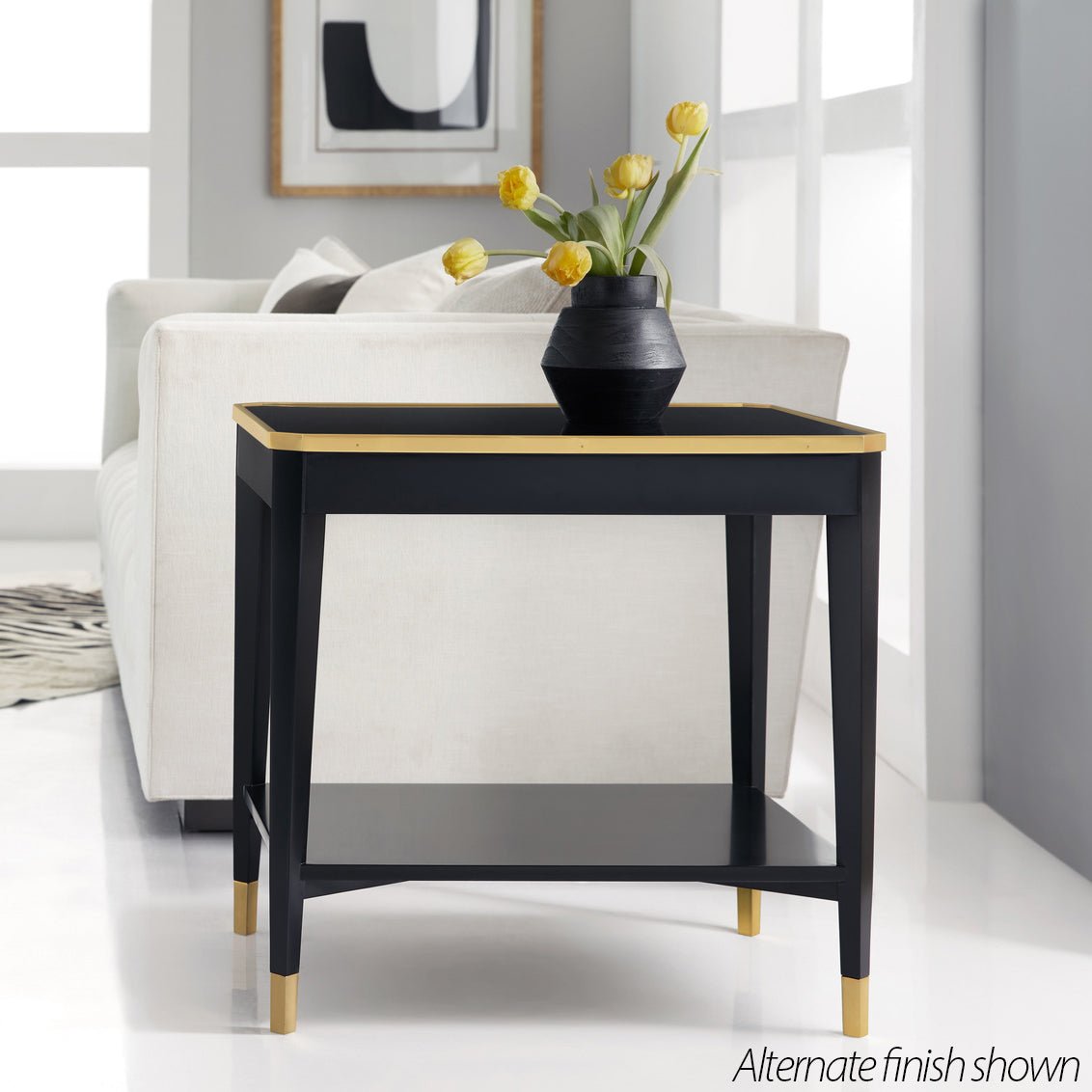 Black mid-century end table, alternate finish, styled in room.
