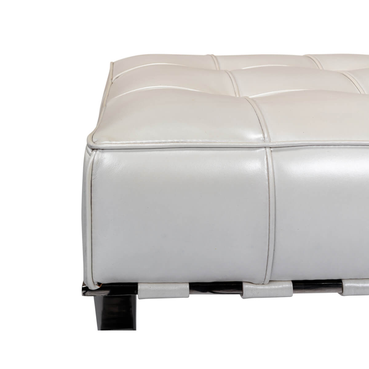 White leather stool corner detail on chrome frame.