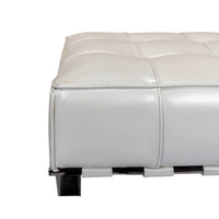 White leather stool corner detail on chrome frame.