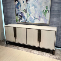 White media cabinet under abstract artwork, room setting