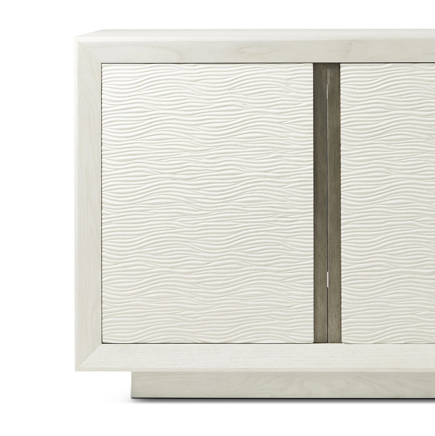 Close-up textured front panel on white media cabinet
