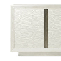 Close-up textured front panel on white media cabinet