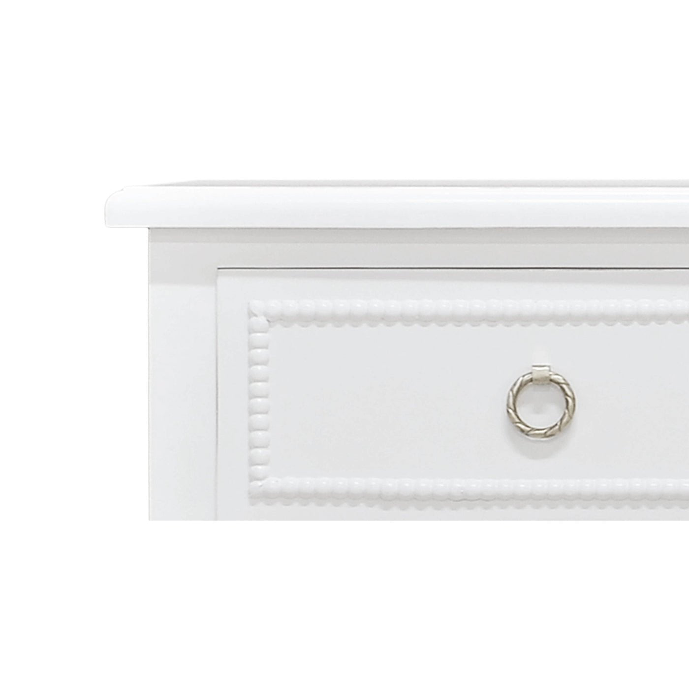 Close-up of white chest of drawers handle.