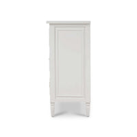 Side view of white antique dresser detailing.