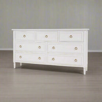White dresser in room setting, three-quarter view.