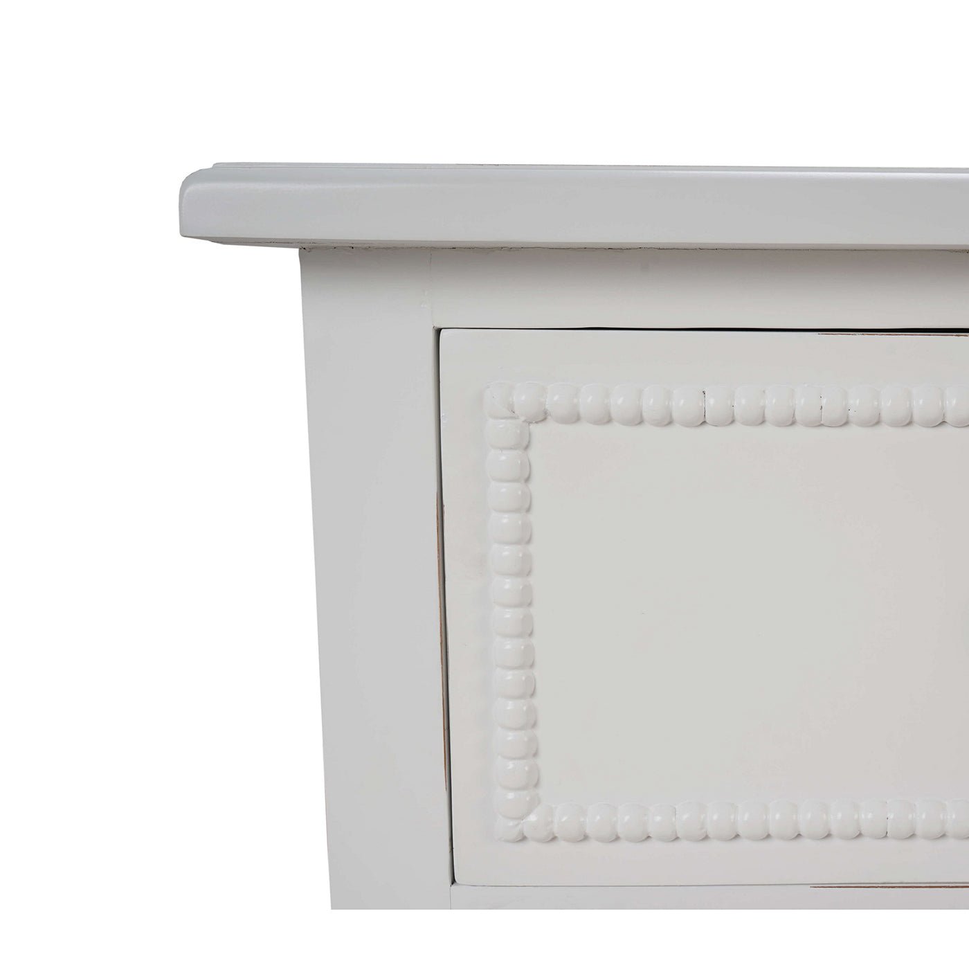 Edge detail of white painted antique dresser.