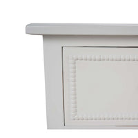 Edge detail of white painted antique dresser.