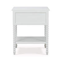 White nightstand back view, beaded legs, smooth back panel.