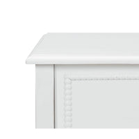 White nightstand close-up, detailed corner, decorative edging.