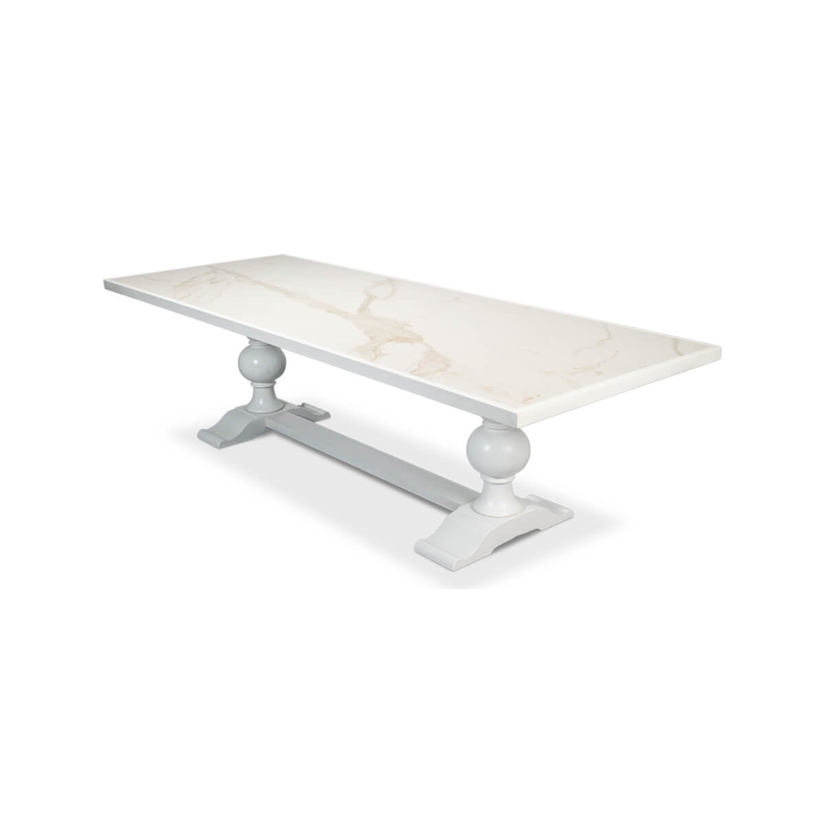 Angled view of white dining table with baroque details.