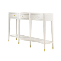 White curved console table on white background, three drawers.