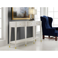 Console table with lamp and painting, elegant room setting.