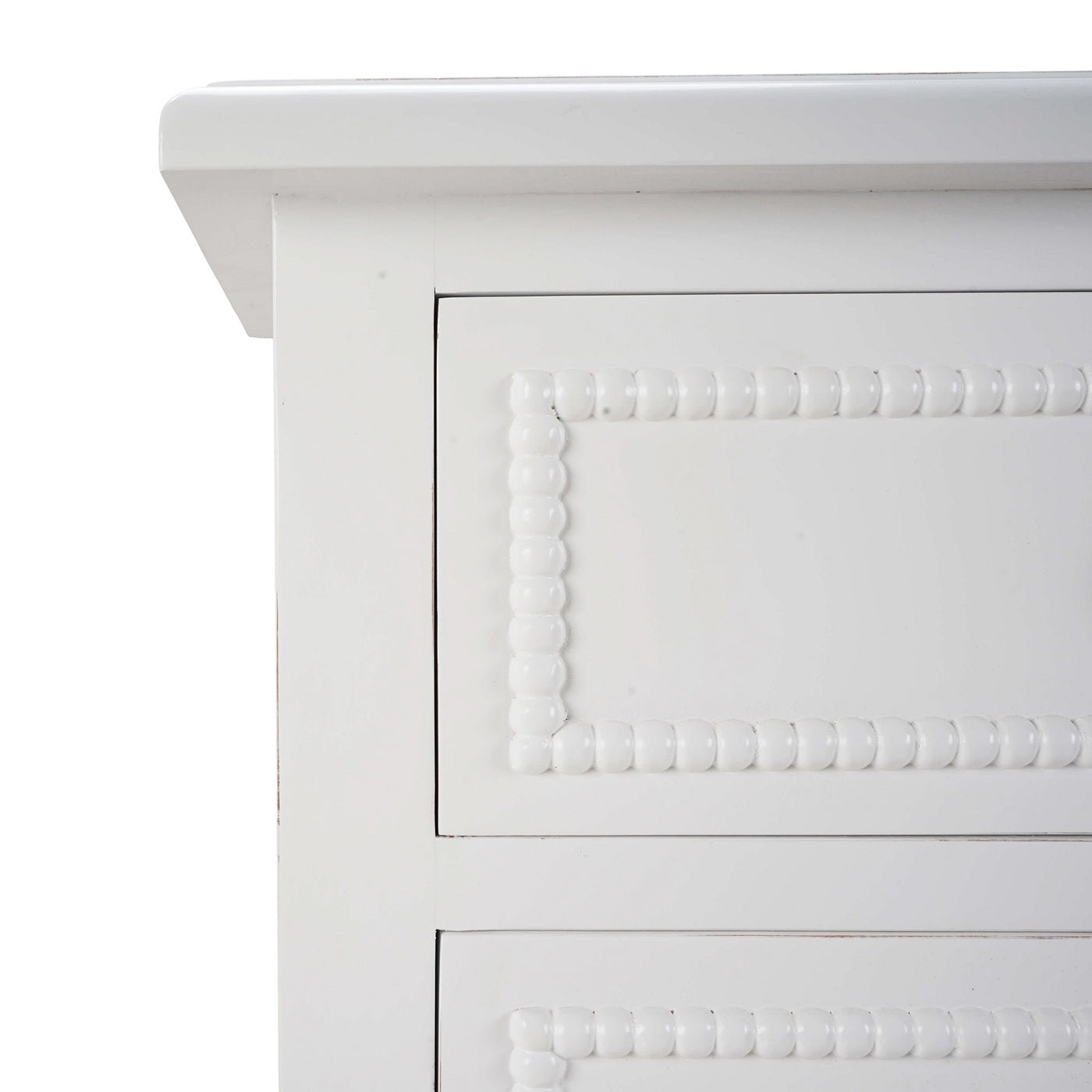 Close-up of bead detailing on white chest.