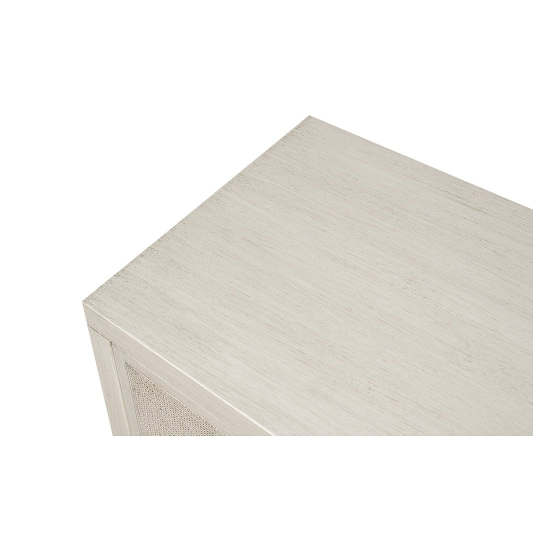 Side cabinet, close-up of top, light wood texture.