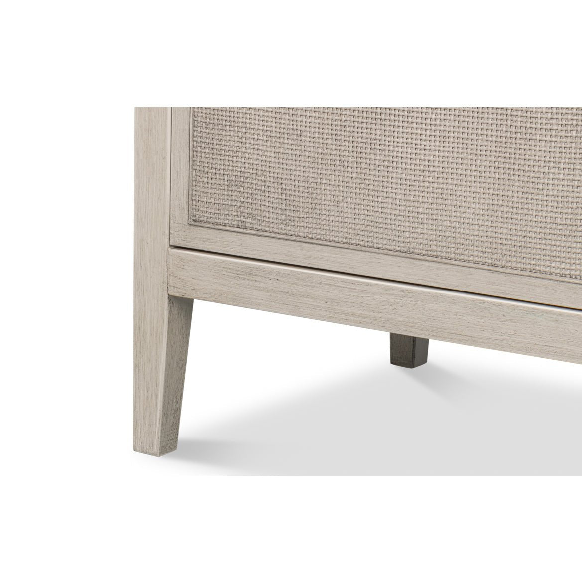 White side cabinet, lower corner, leg detail.