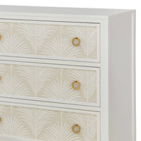 Close-up of white dresser drawer with palm detail.