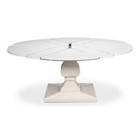 Round white extending dining table with reeded pedestal base