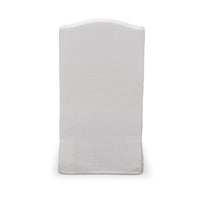 White slipcovered dining chair, rear view of backrest.