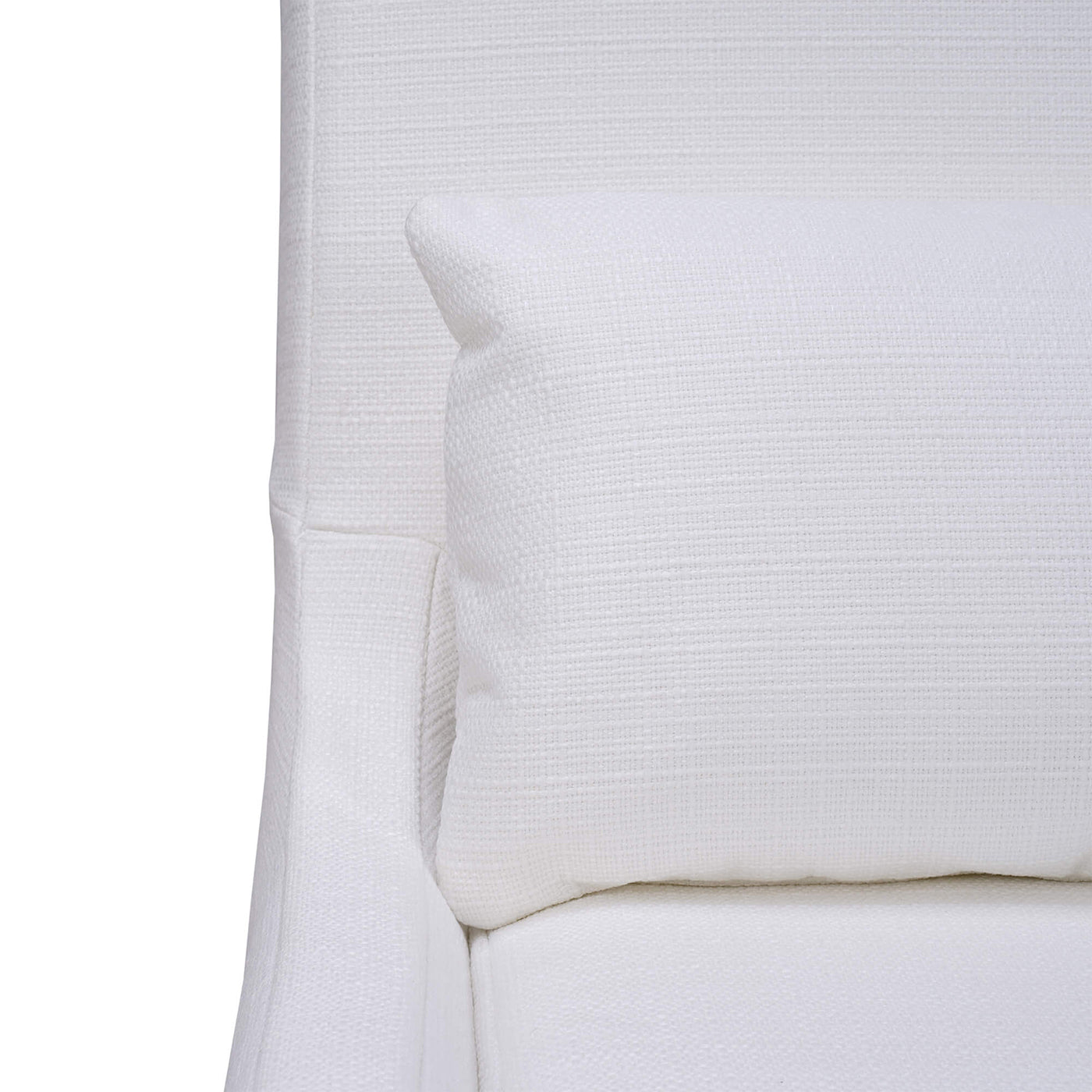 Close-up of chair with cushion, white slipcover.