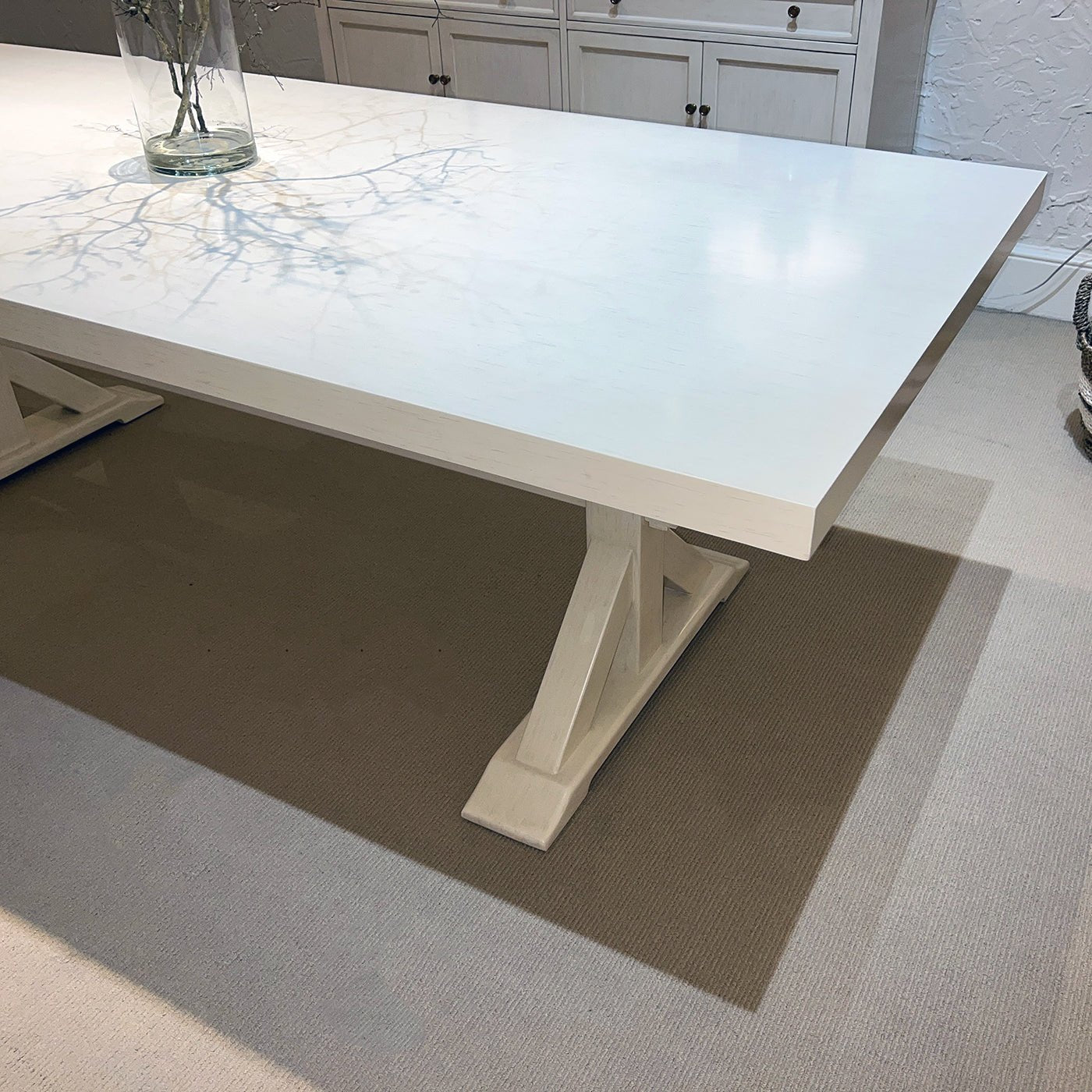 Corner view of dining table, sleek smooth surface.