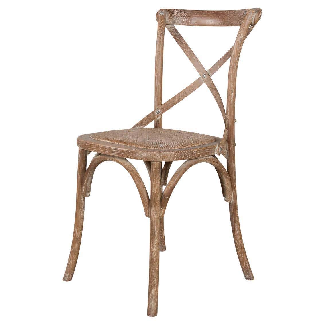 Rustic wood dining chair, angled view, cross-back design.