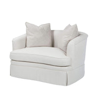 Beige art deco armchair, front view with pillows.