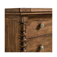 Close-up of nightstand corner, spindle detail emphasized.