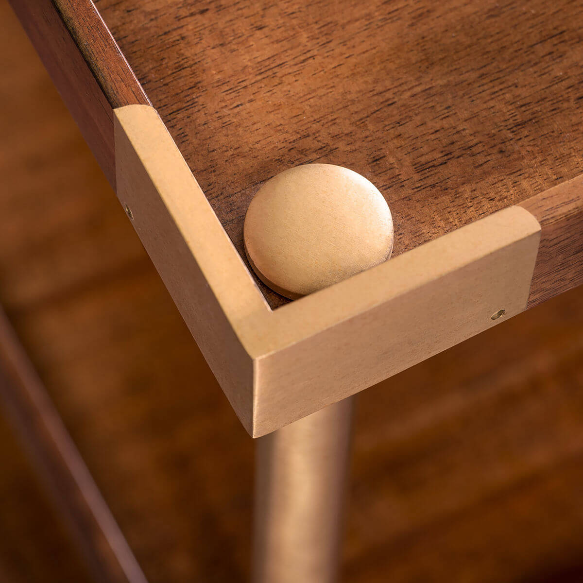 Close-up wooden shelf corner of wide modern etagere.