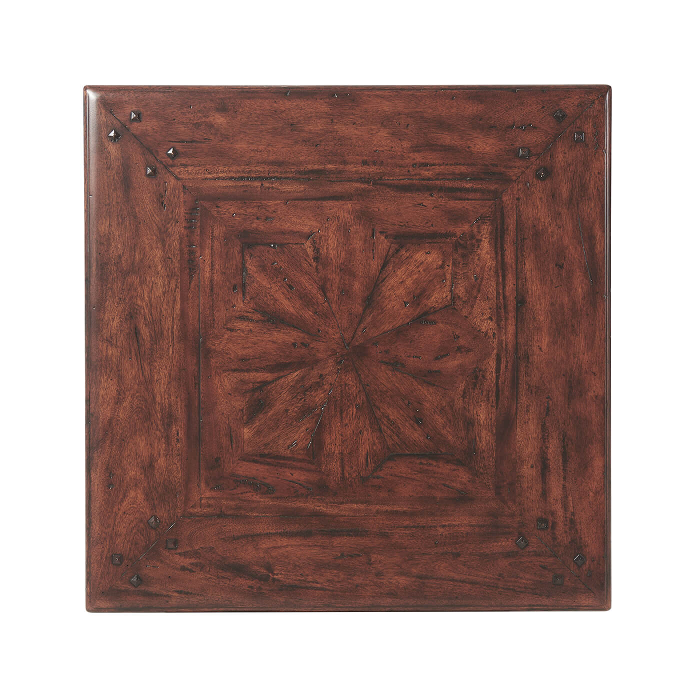 Detailed top view of antique end table with pattern.