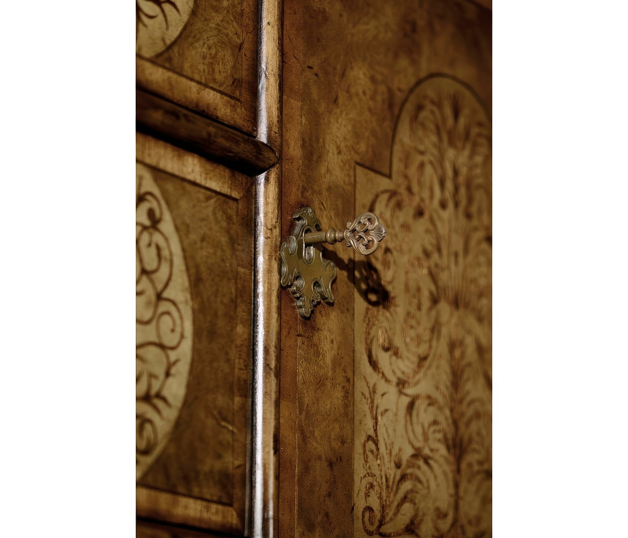 Side view, decorative key in marquetry cabinet lock.