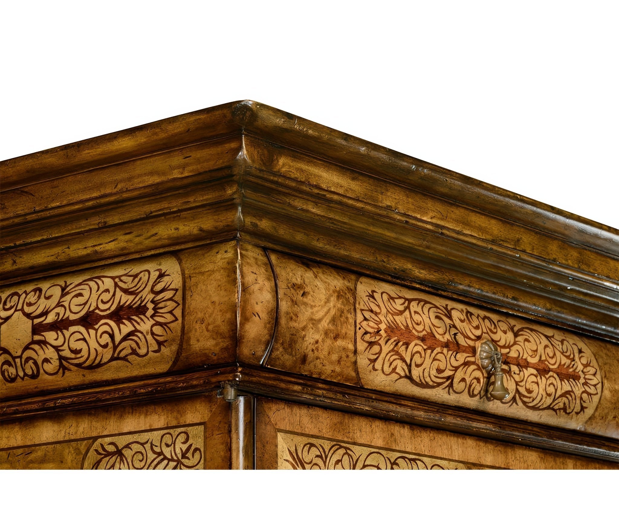 Upper corner, marquetry cabinet showing decorative woodwork.