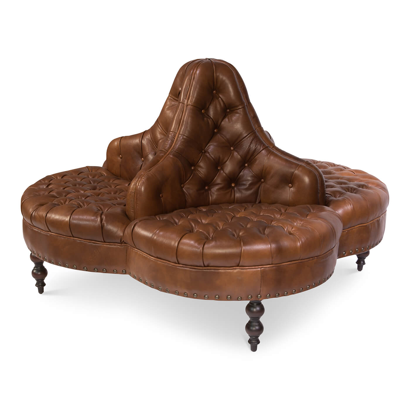 Round brown leather lobby sofa, side angle, tufted seat.