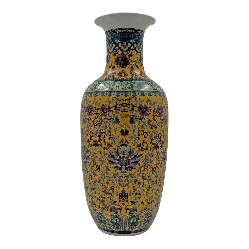 Chinese export yellow vase with intricate floral motifs.