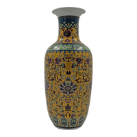 Chinese export yellow vase with intricate floral motifs.
