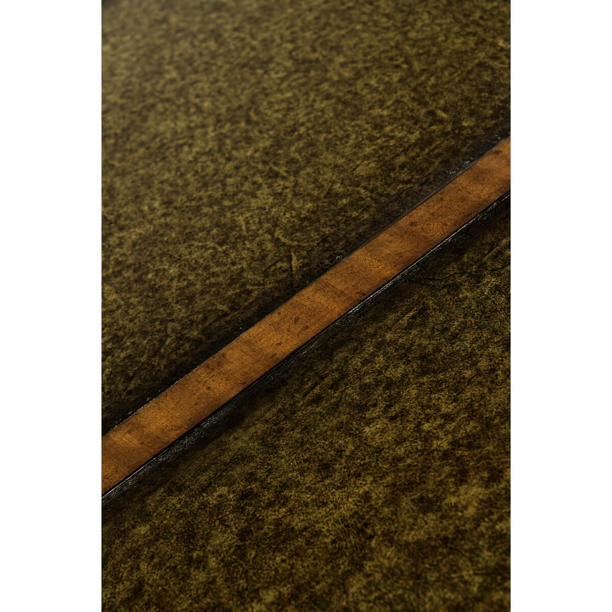 Close-up of green leather desk surface texture.