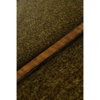 Close-up of green leather desk surface texture.