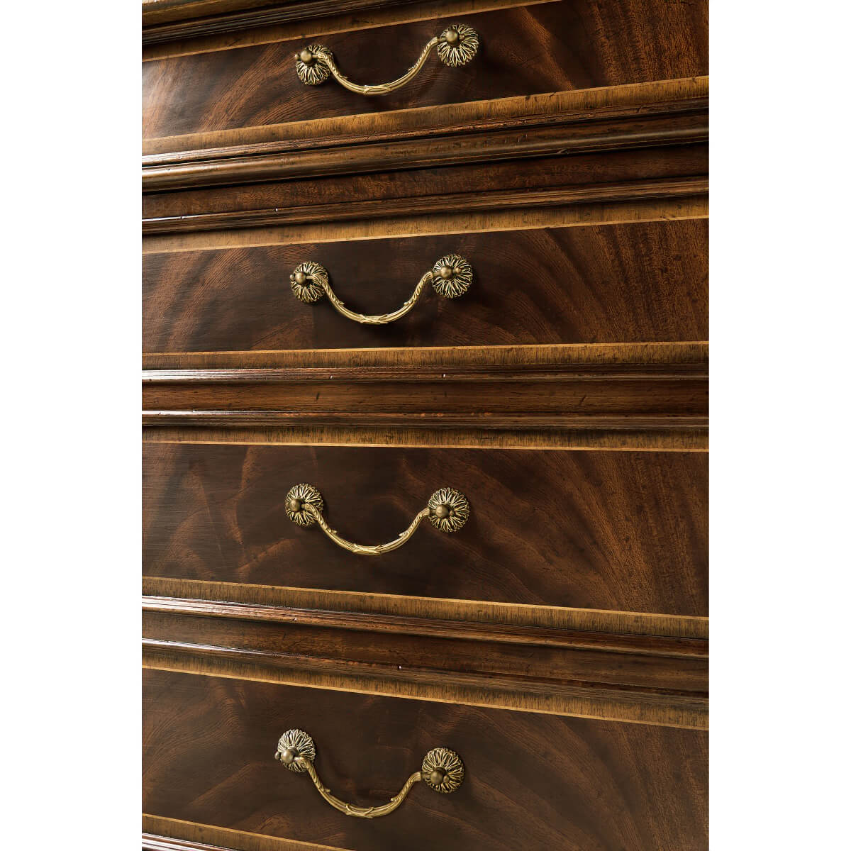 Side view of ornate desk drawer handles.