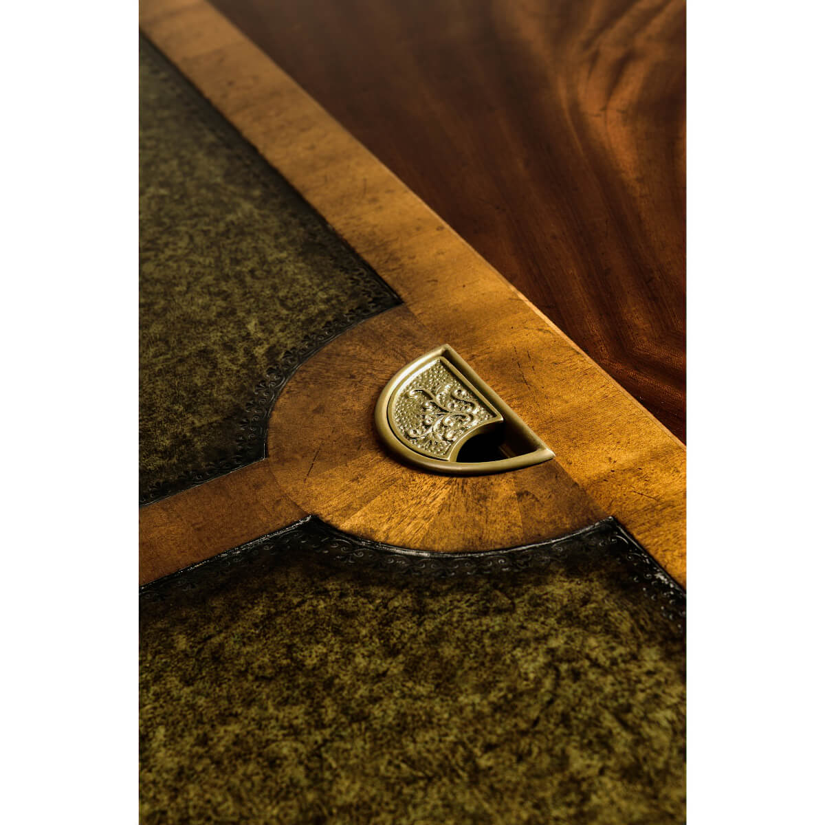 Detailed shot of brass trim on partners desk.
