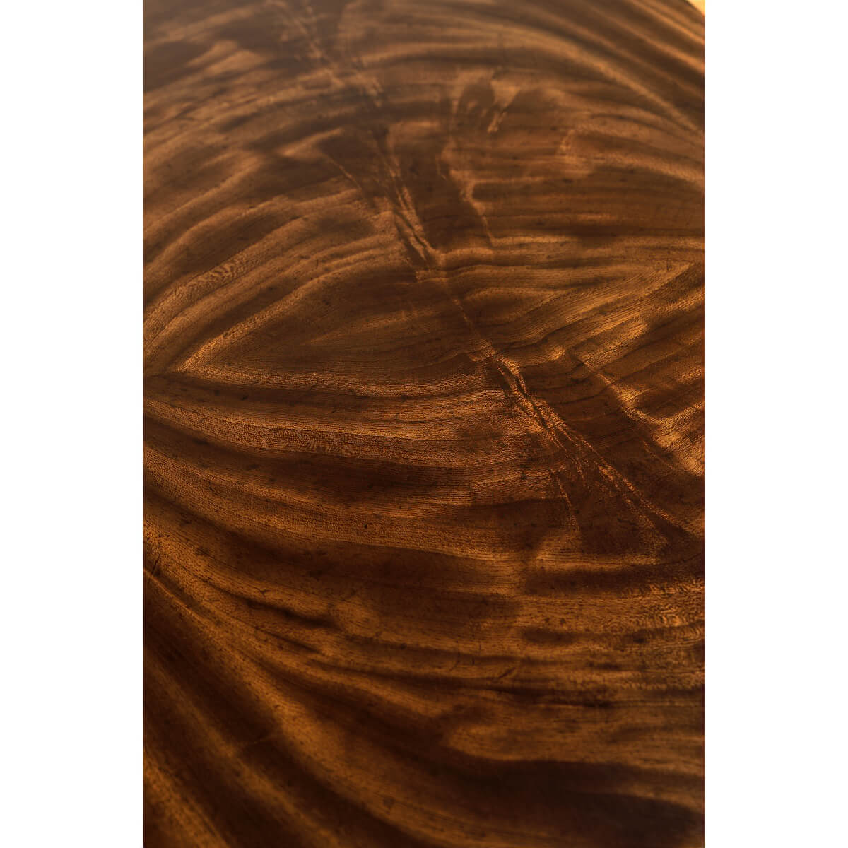 Detailed texture of mahogany wood grain on desk.