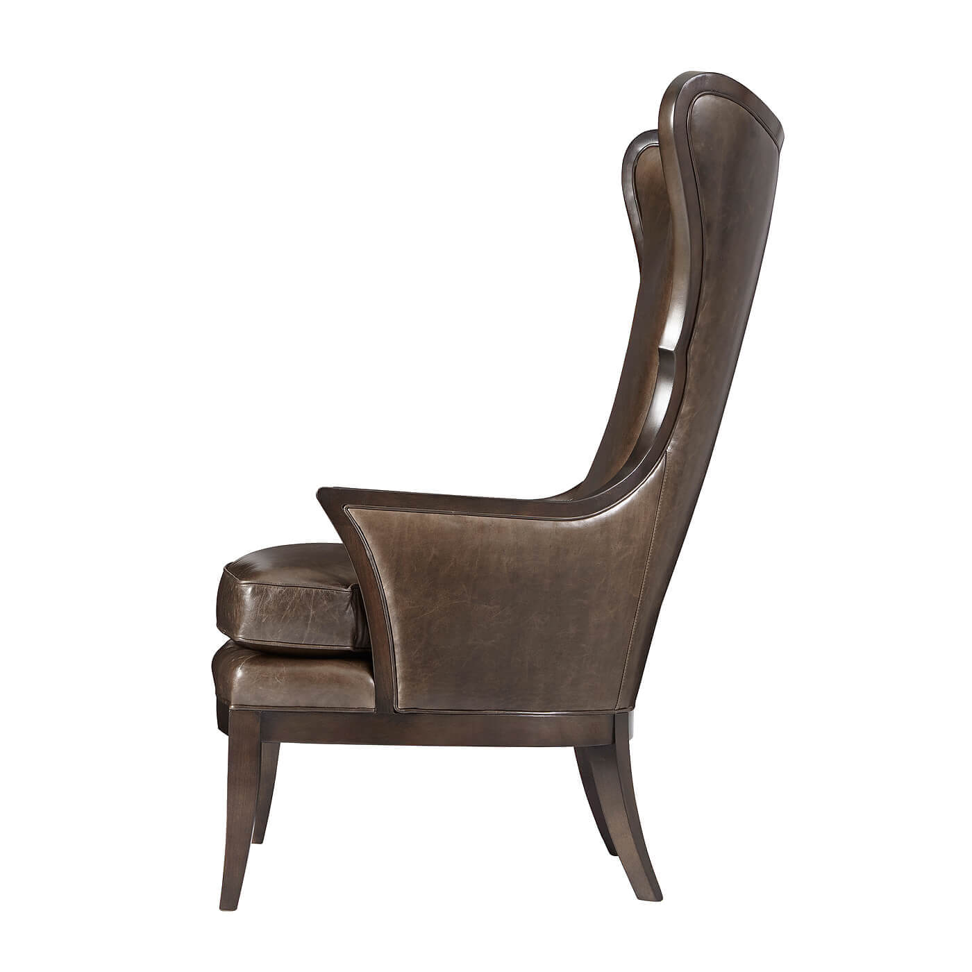 Modern upholstered wingback chair, side view.