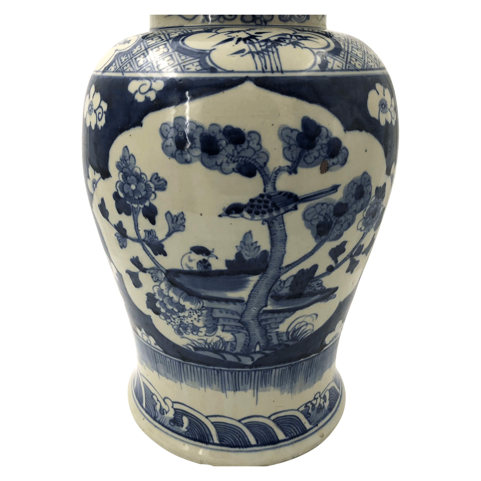 Close-up of floral and tree design on Chinese jar.