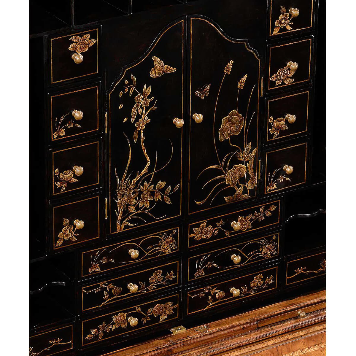 Close-up Chinoiserie detail on secretary bookcase drawers.
