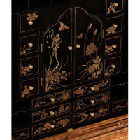 Close-up Chinoiserie detail on secretary bookcase drawers.